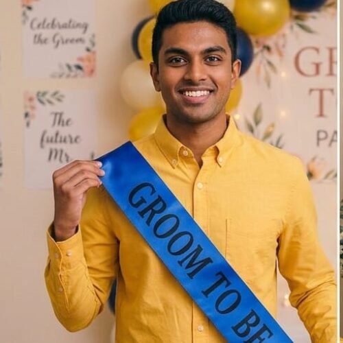 a smiling groom-to-be wearing a yellow button-down shirt and a premium royal blue satin sash with bold black text reading groom to be